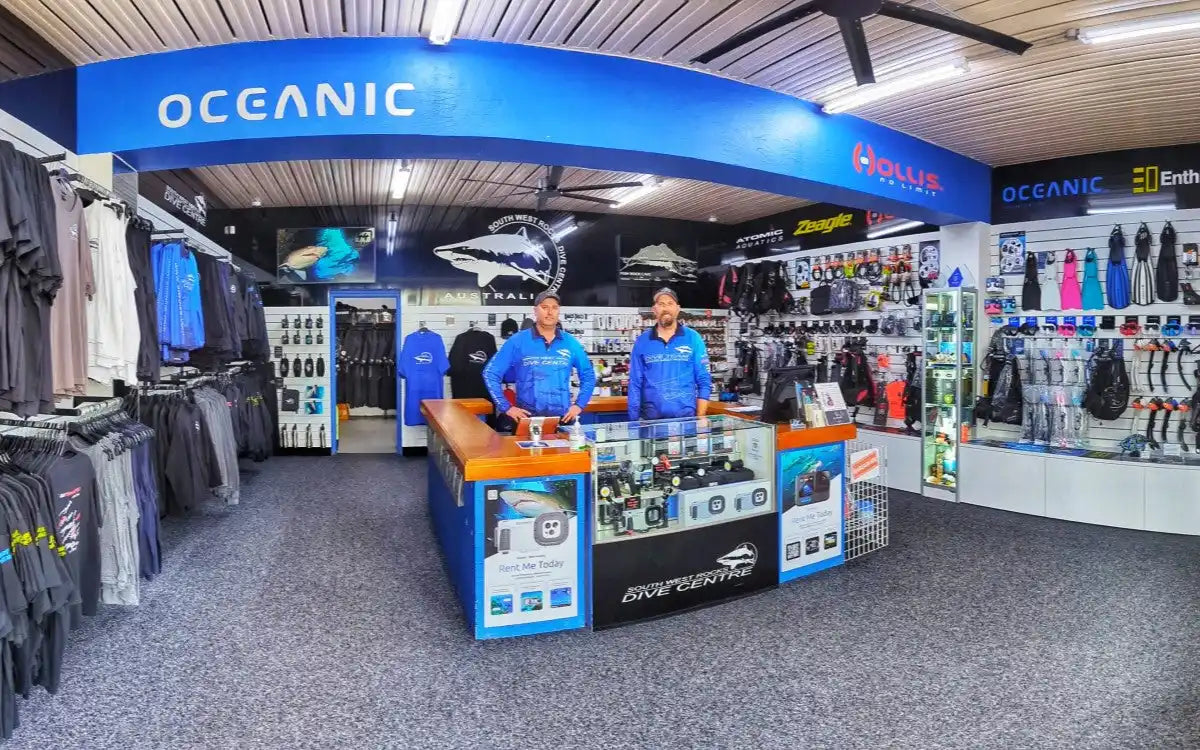 Oceanic retail store counter and display area with diving equipment and apparel.